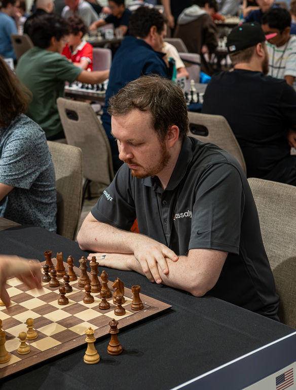 Dalton in Chessalyz polo, focused at the board