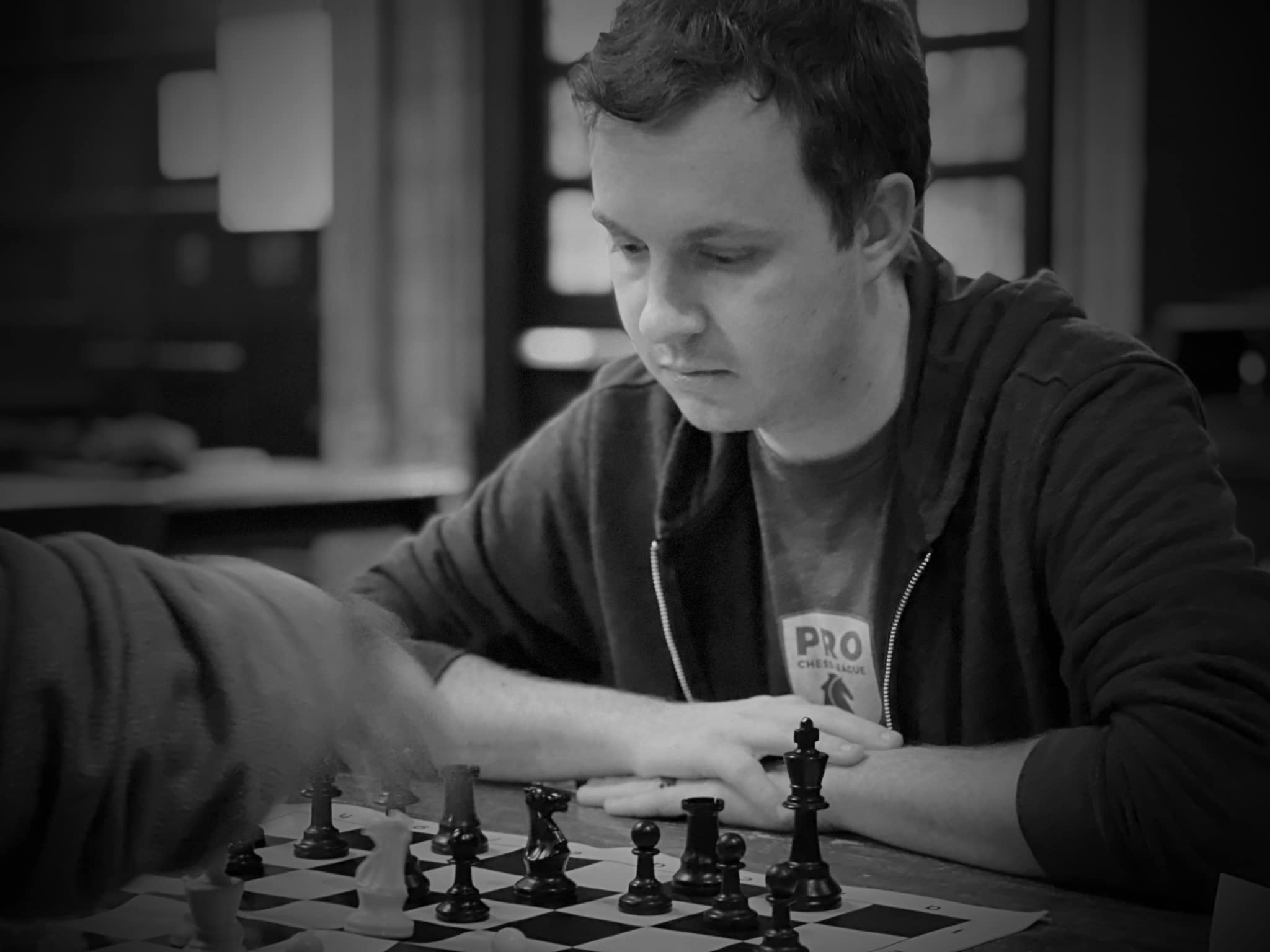 Dalton at the board in black and white — Pro Chess League